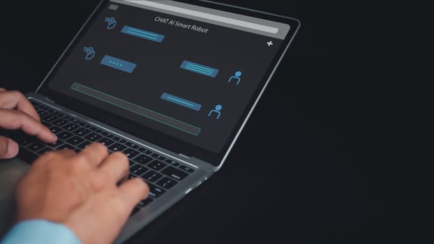 Businessman uses computer to type chat Ask and answer with the artificial intelligence system, chatbot, AI assistant.