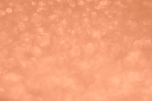 Peach Fuzz lights bokeh background, Chrismas lights bokeh. Monochrome abstract background. Blurred and glowing lights. Classic blue bokeh lens effect from lighting spots. High quality photo
