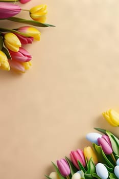 Colorful tulips and eggs lying on teal beige background with copy space for easter celebration