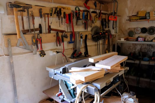 Hand tool on the background of the carpentry workshop. Photo in high quality.