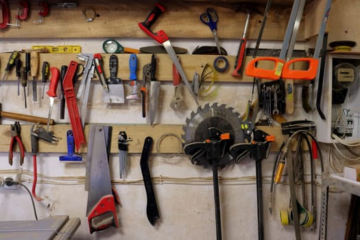 Hand tool on the background of the carpentry workshop. Photo in high quality.