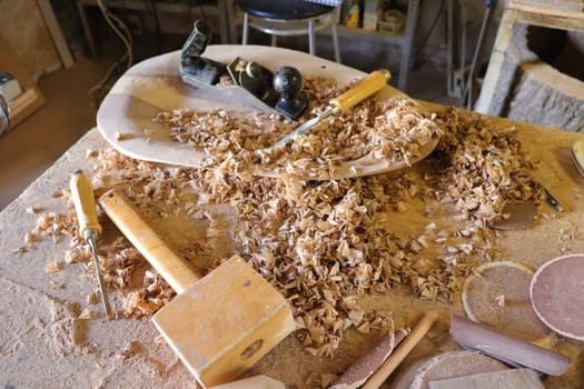 Hand tool on the background of the carpentry workshop. Photo in high quality.