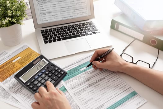 Polish individual income tax return. Accountant working with Polish tax forms