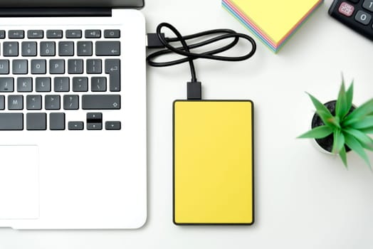 External hard disk connected to laptop. USB drive backup data