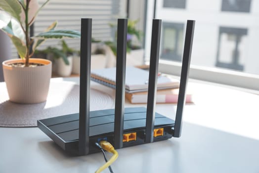 Router with 4 antennas in living room. High speed internet concept