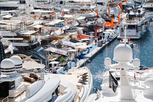 Monaco, Monte Carlo, 27 September 2022 - a lot of luxury yachts at the famous motorboat exhibition in the principality, the most expensive boats for the richest people around the world, yacht brokers. High quality photo