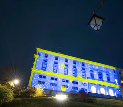 Udine, Italy, December 2023. the Christmas light decorations projected on the buildings of the historic center of the city