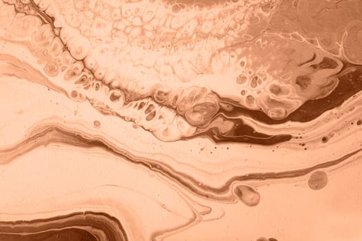 The texture of marble. Spread-out acrylic paint. Abstract background, made in the technique of fluid art. Demonstrating the colors of 2024 - Peach Fuzz