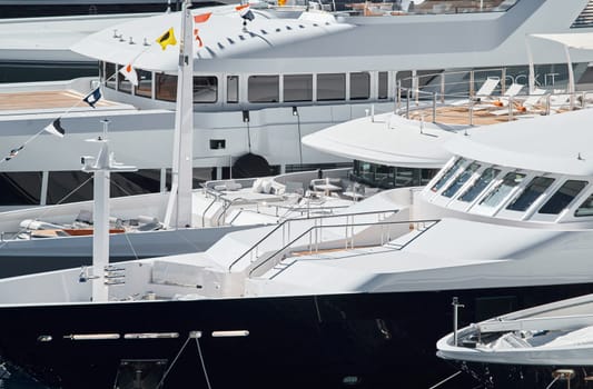 Monaco, Monte Carlo, 27 September 2022 - a lot of luxury yachts at the famous motorboat exhibition in the principality, the most expensive boats for the richest people around the world, yacht brokers. High quality photo