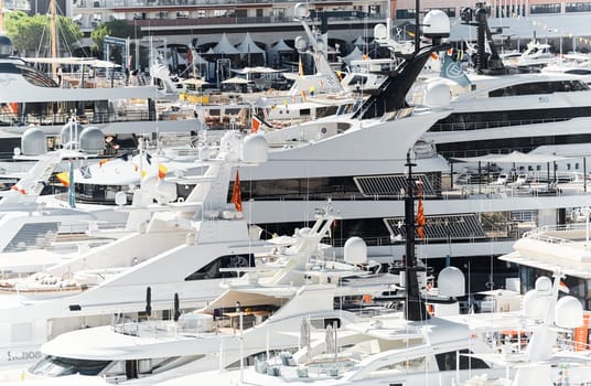 Monaco, Monte Carlo, 27 September 2022 - a lot of luxury yachts at the famous motorboat exhibition in the principality, the most expensive boats for the richest people around the world, yacht brokers. High quality photo