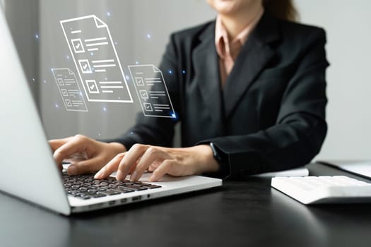 Businesswoman working on a laptop computer to document management online documentation database digital file storage system software records keeping database technology file access doc sharing.