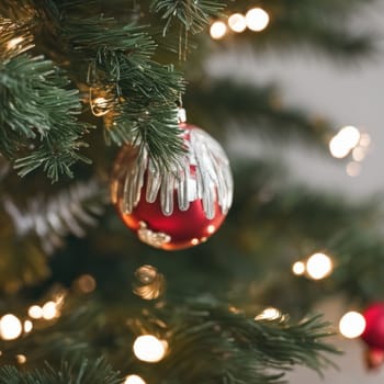 Close-UP of Christmas Tree, Red and Golden Ornaments against a Defocused Lights Background