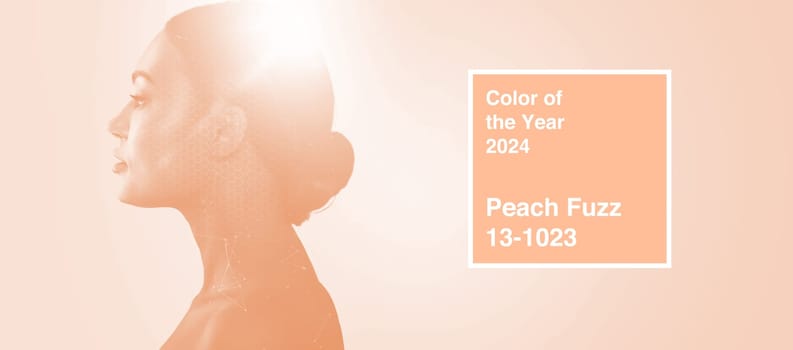 Young woman portrait toned in color of the year 2024 peach fuzz concept