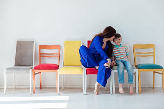 Woman with boy and many chairs