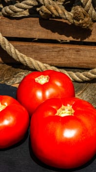 Close up of fresh ripe tomatoes isolated in a rustic composition,