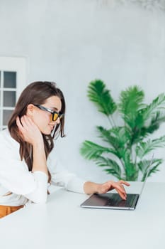 Business woman working on laptop in office finance business online