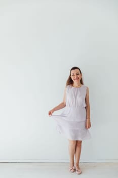 woman 40 years old in light light summer dress