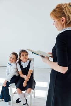 Teacher teaching children in school