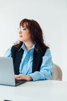 Woman working on laptop in office finance business
