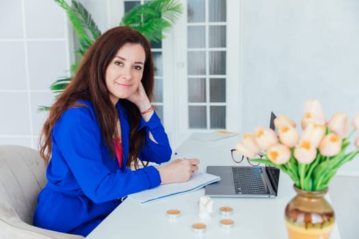 Business woman in office working on laptop online small business