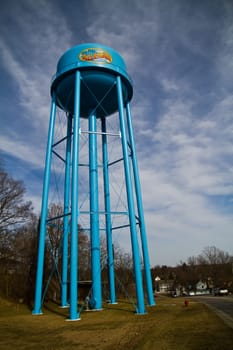 Iconic Allegan Water Tower stands tall against a vibrant sky, showcasing municipal services and community pride in Allegan, Michigan.