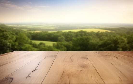 Empty wooden tabletop on the blurred background of meadows and forest and the sky