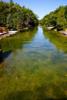 Experience the serenity of nature at this picturesque river in Michigan, surrounded by lush greenery and sparkling clear water. Perfect for outdoor enthusiasts and nature lovers seeking tranquility and recreational activities.