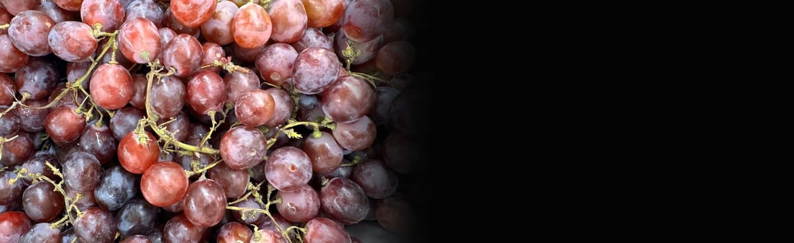 Close up of raw organic sweet red grapes background, wine grapes texture, Healthy fruits Red wine grapes background, top view fresh local produce, good for your multimedia content creation