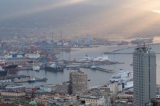 Panorama of the sea port of the city of Napoli in the morning with Vesuvius in the background.