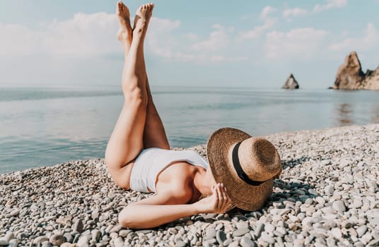 Woman white bikini beach tan. Happy woman in swimwear and hat on vacation. Summer travel holidays vacation on the sea.