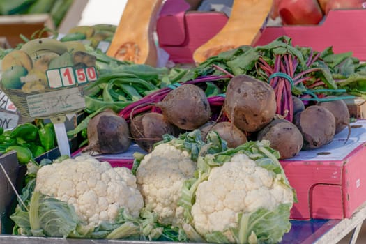 assorted vegetables in a street fruit market, cauliflowers in the foreground