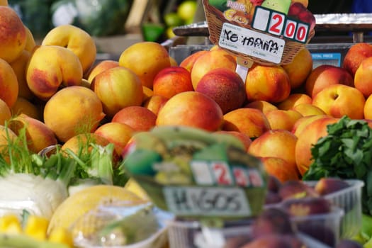 piles of fruit at a vegetable stall a street market