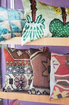 Colourful cushions on display for sale in a traditional Turkish Bazaar