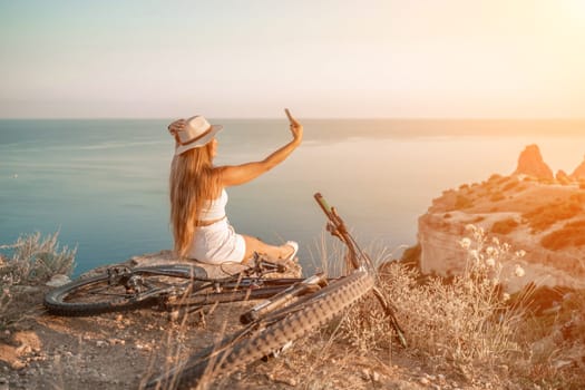 Selfie woman in cap and tank top making selfie shot mobile phone post photo social network outdoors on sea background beach people vacation lifestyle travel concept