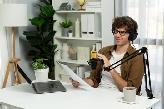 Host channel of influencer reading question script with listeners on social media with laptop in life coaching. Concept of radio online for consulting lifestyles at cozy studio modern office. Gusher.