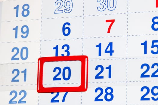 White calendar with a marked date twentieth close up