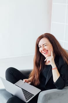 Woman working on laptop small business at home