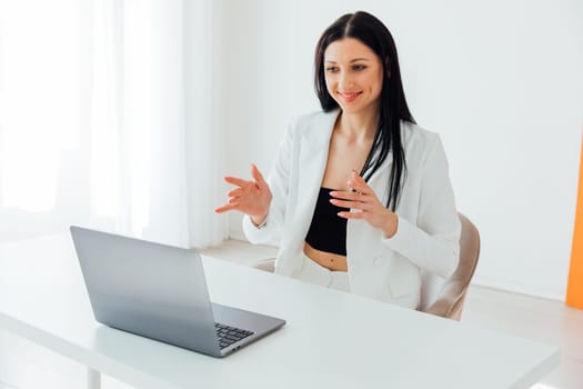 Woman in business suit working on laptop small business online office