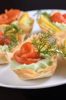 Avocado whipped with soft cheese cream into the most delicate mousse, a slice of salmon and lemon. Served in crispy baskets with phyllo dough baked in the oven. The perfect appetizer for a holiday menu