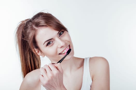 girl cleans teeth toothbrush white smile