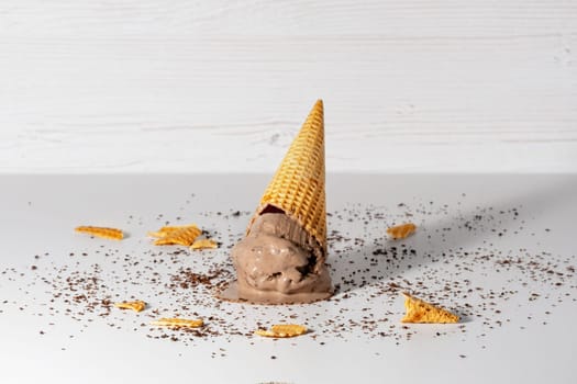 Chocolate ice cream cone drop upside down.