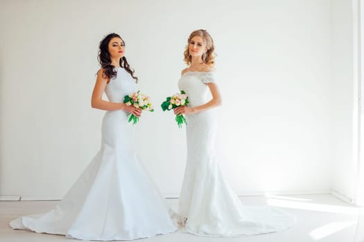 two wedding bride with bouquet wedding hairstyle