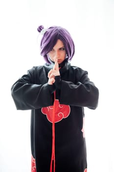 Beautiful woman anime cosplayer with purple hair nindz Japan