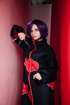 Beautiful woman anime cosplayer with purple hair nindz Japan
