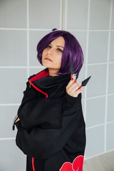 Beautiful woman anime cosplayer with purple hair nindz Japan