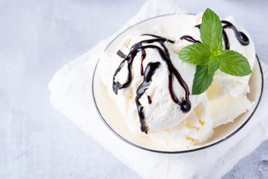 Bowl of vanilla ice cream isolated on white background.