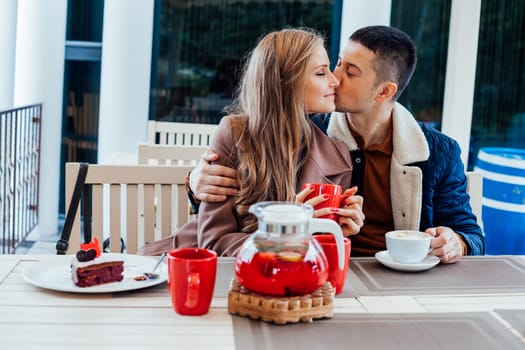 restaurant. a guy with a girl drink hot coffee and tea 1