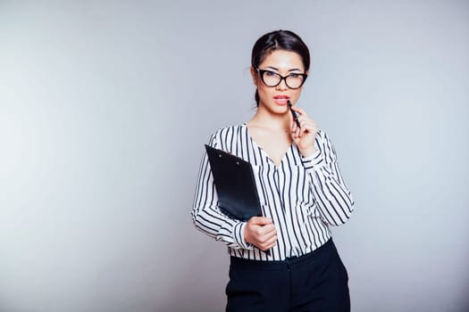 business girl in glasses works in the Office of the Secretary