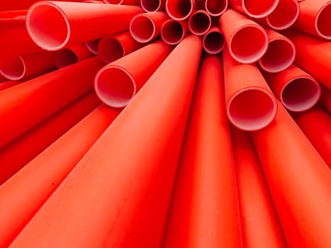 red plastic water pipes at the construction site background