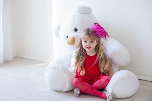 Girl with soft bear toy gift
